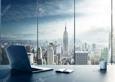 37678678-laptop-cup-and-diary-on-table-in-office